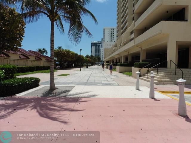 Promenade between building & pool area.