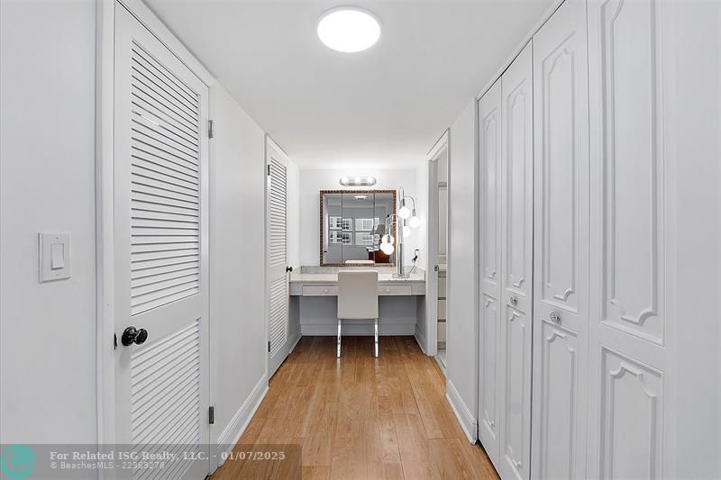 PRIMARY BEDROOM WITH A HUGE WALK-IN CLOSET TO THE LEFT AND ANOTHER EXTRA CLOSET TO THE RIGHT