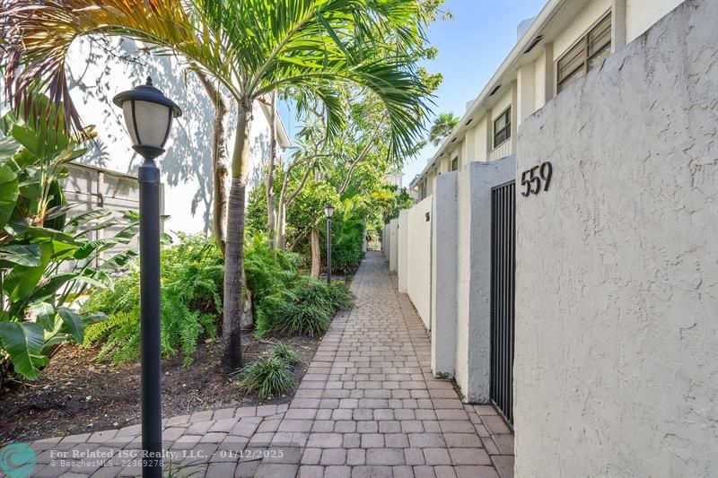 community walkway to gated private entrance