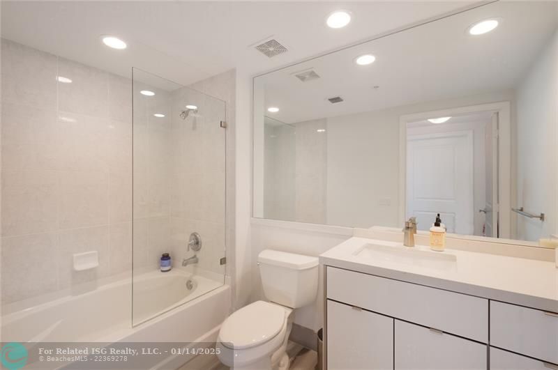 Guest Bath with tub/shower combo - custom cabinetry & countertops in both bathrooms