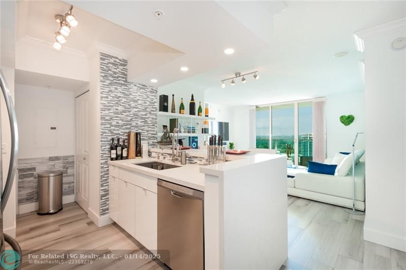 Kitchen- porcelain floors throughout the entire residence